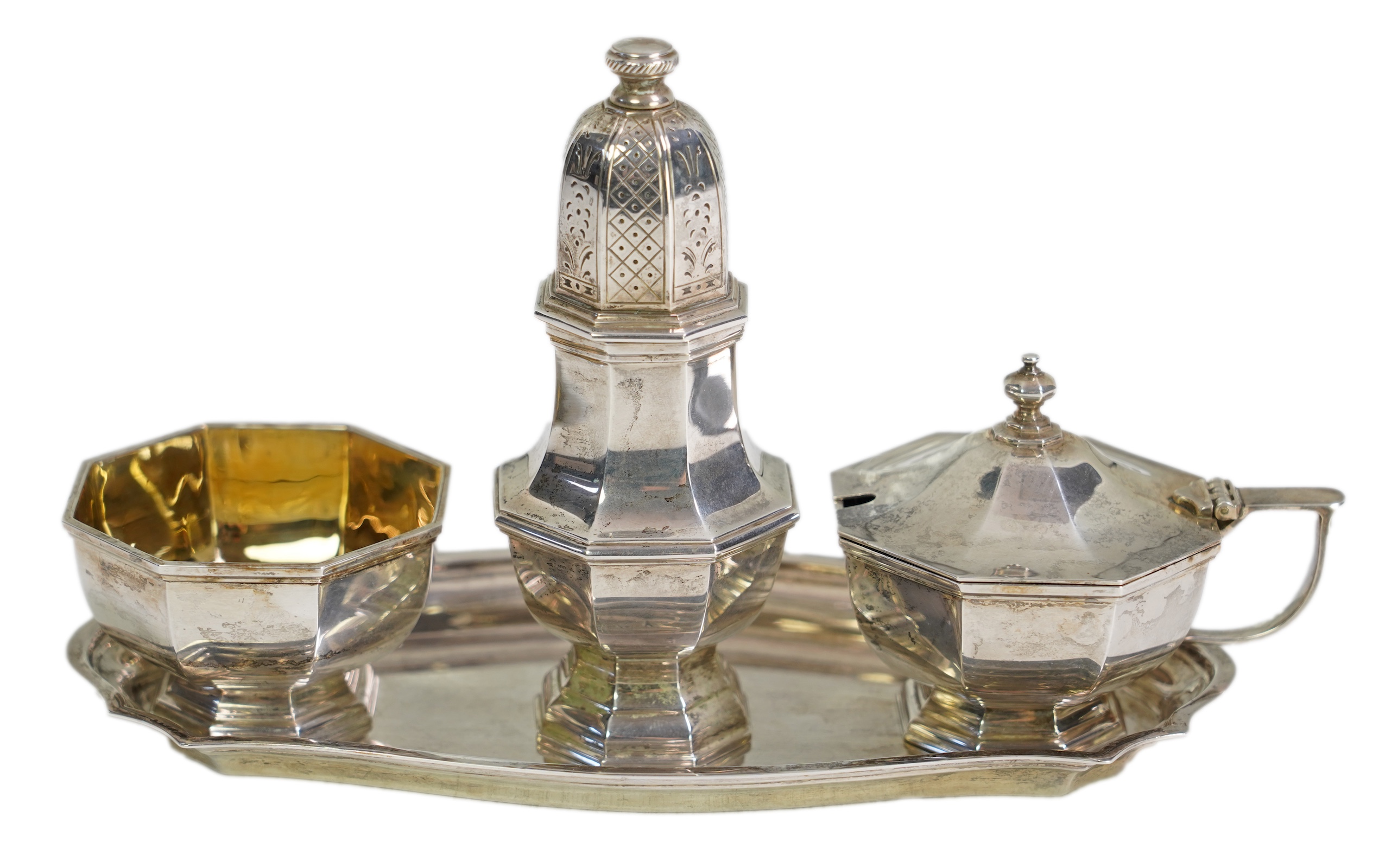 An Elizabeth II Asprey & Co silver three piece condiment set on stand